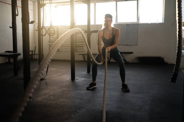 istock Caucasian woman, doing the training with ropes 1371307872