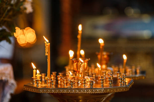 istock Set of fired candles standing in the church 1371309497