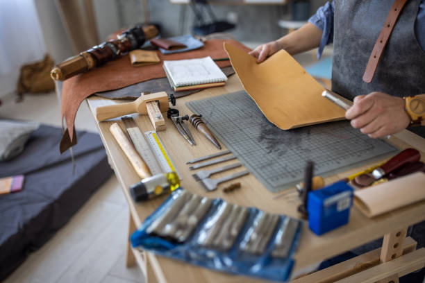 istock Female artisan working in her leather crafting workshop 1371310833