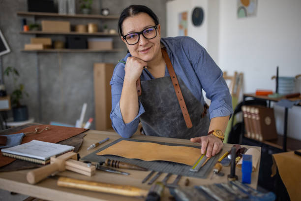 istock Portrait of leather craftsman in her workshop 1371311655