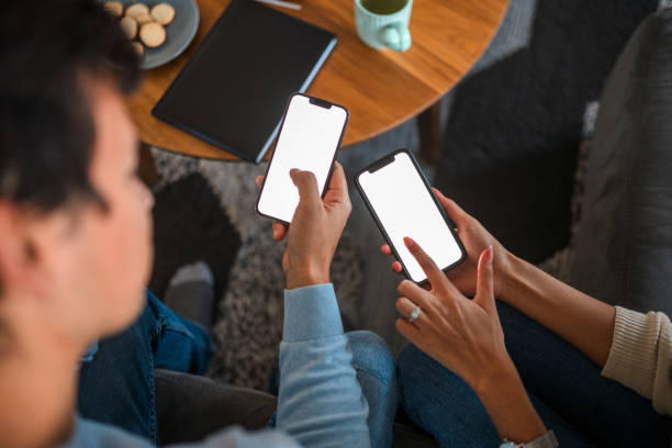 Man And Woman Using Smartphones For Devlivery Service
