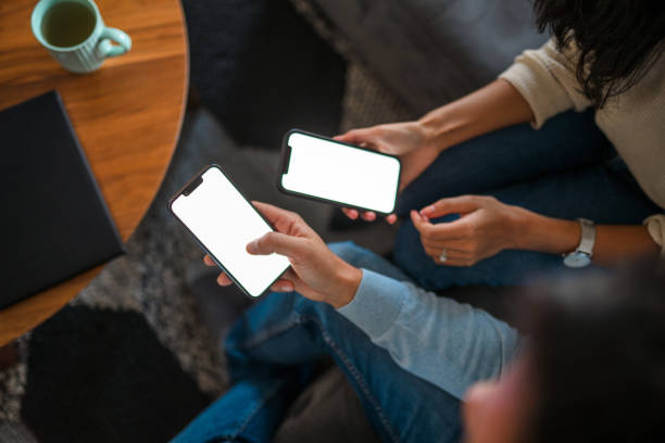 istock Man And Woman Using Smartphones For Devlivery Service 1371311714