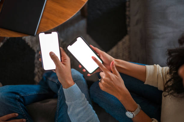 istock Man And Woman Using Smartphones For Devlivery Service 1371311718