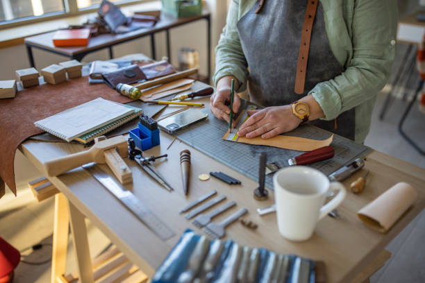 istock Female artisan working in her leather crafting workshop 1371311816