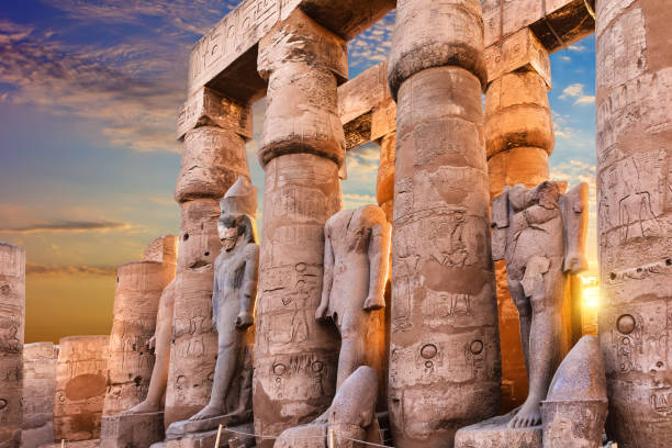istock Standing Ramses II statues in Luxor Temple, beautiful sunset view, Egypt 1371312053
