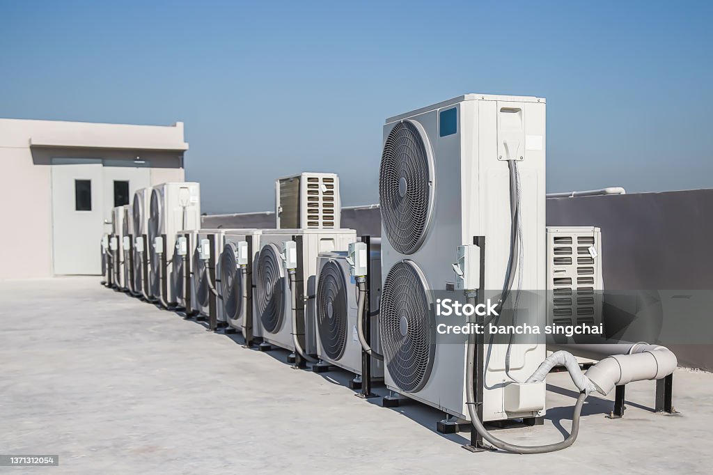 air condition outdoor unit compressor install outside the building. Air Conditioner Stock Photo