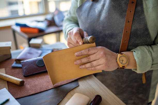istock Woman working on handmade leather products in her workshop 1371315048