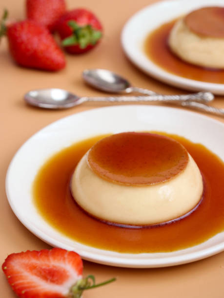 istock A caramel custard pudding with vanilla flavor in a white plate with strawberries 1371315391