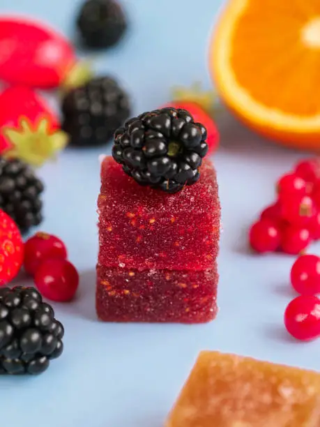 A colorful traditional French fruit jellies with fresh variant fruit as strawberry, blackberry, orange and red currant.  Ingredients are concentrate fruit paste, sugar and pectin dusting with sugar