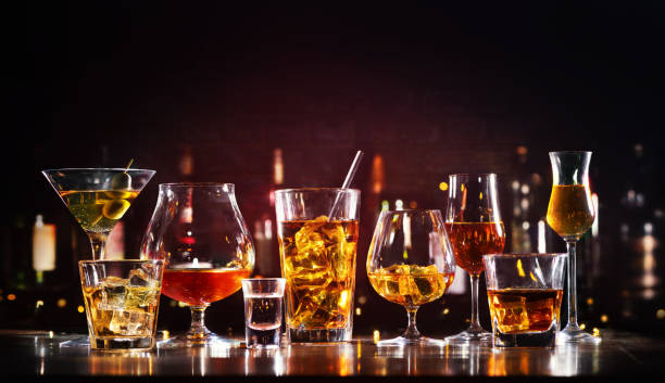 Assortment of hard strong alcoholic drinks and spirits Assortment of hard strong alcoholic drinks and spirits in glasses on bar counter cocktails stock pictures, royalty-free photos & images