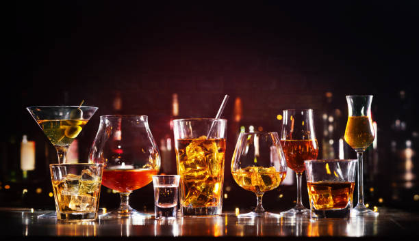 Assortment of hard strong alcoholic drinks and spirits Assortment of hard strong alcoholic drinks and spirits in glasses on bar counter bar stock pictures, royalty-free photos & images