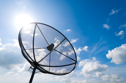 silhouette satellite dish antennas under sky
