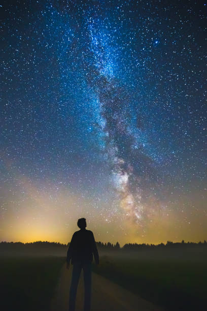 istock Night sky aesthetics, man looking at the stars 1371318651