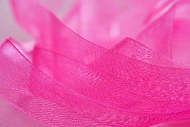 pink ribbon on pink background