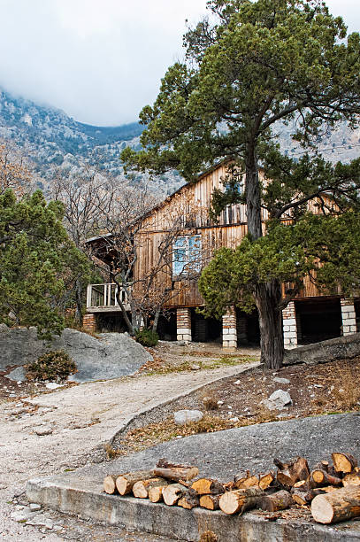istock Wooden house among mountains 137131921