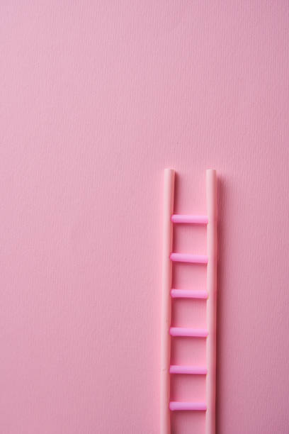 istock ladder on pink color background 1371319668