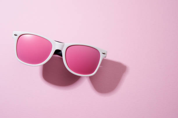istock pink color sun glasses on the pink background with shadow 1371319937
