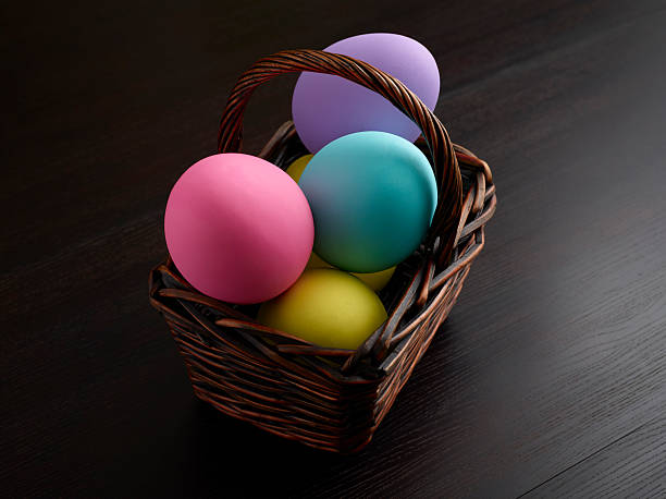 Colored Easter Eggs on Dark Wood stock photo