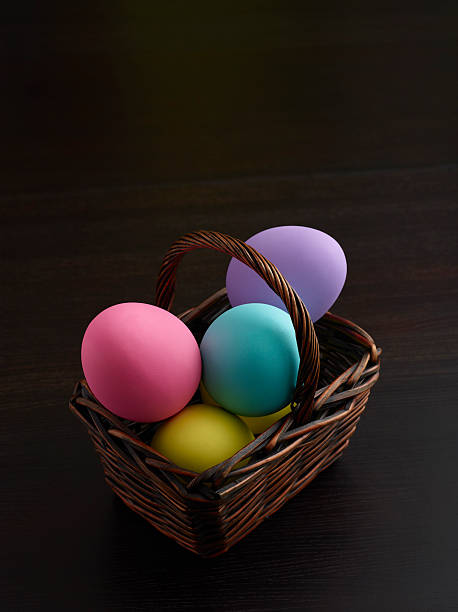 Colored Easter Eggs on Dark Wood stock photo