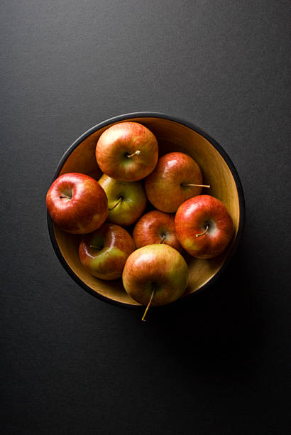 Wodden Bowl full of Apples stock photo