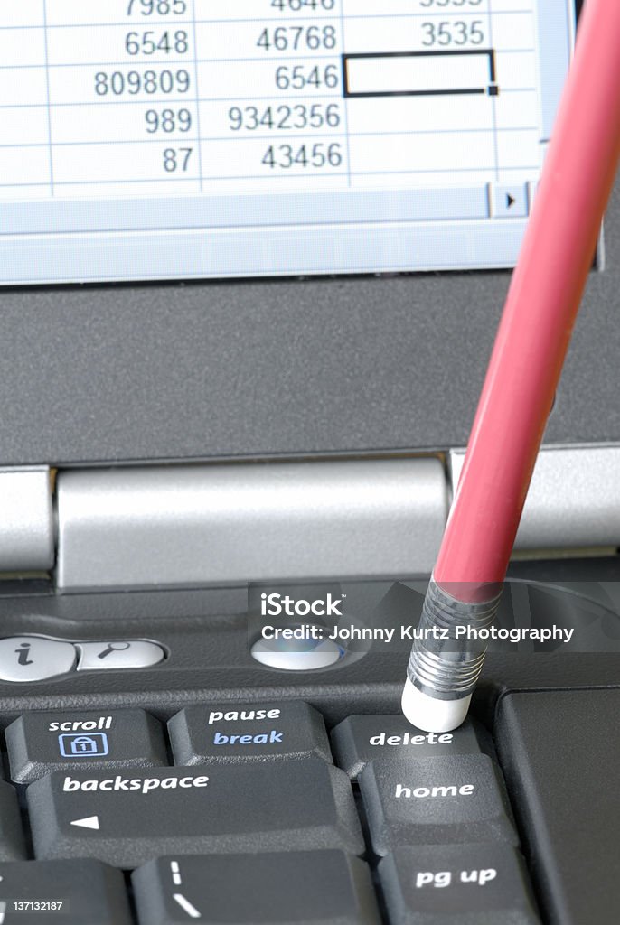 Delete Key Using a pencil eraser to push the delete key on a laptop computer Laptop Stock Photo