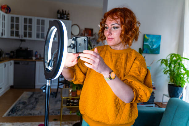 istock Young  influencer adjusting her smart phone before a vlog post 1371322040