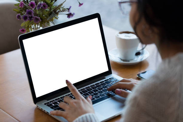 Using blank white screen laptop Using blank white screen laptop looking over shoulder stock pictures, royalty-free photos & images