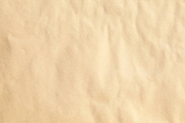 istock Crumpled brown kraft paper texture 1371323265