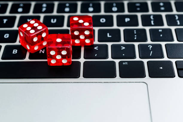 istock Red dices on laptop keyboard 1371324684