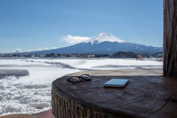istock mount Fuji with smart phone and glasses in winter 1371324905
