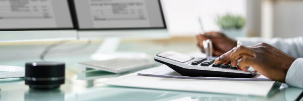 istock Bookkeeper Accountant Calculating Tax Invoice 1371325547