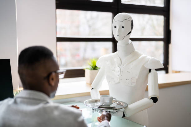 istock Humanoid Cyborg AI Robot Assistant Bringing Coffee To Boss 1371325591