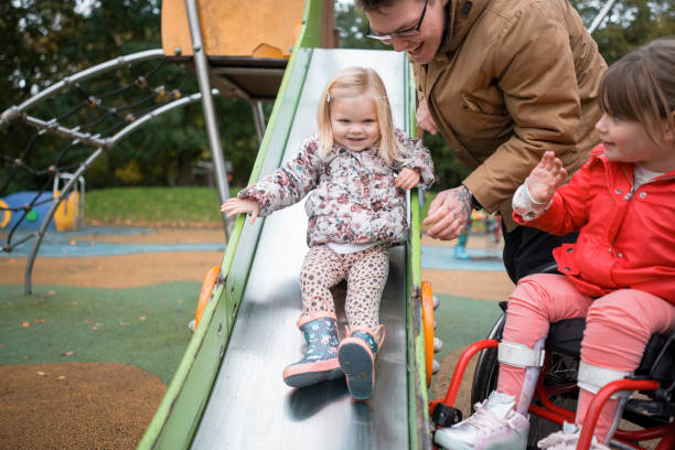 istock Playing On The Slide In The Park 1371325939