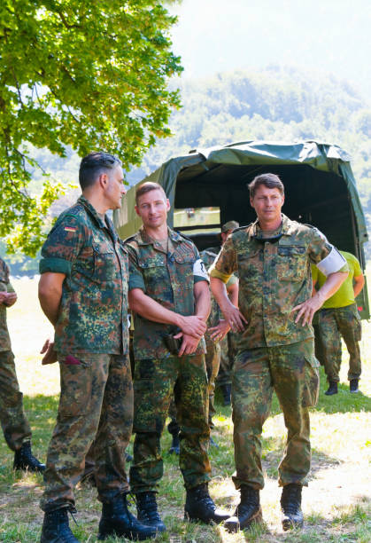 istock Two Captains and and a staff sergeants observing a military exercise 1371326569