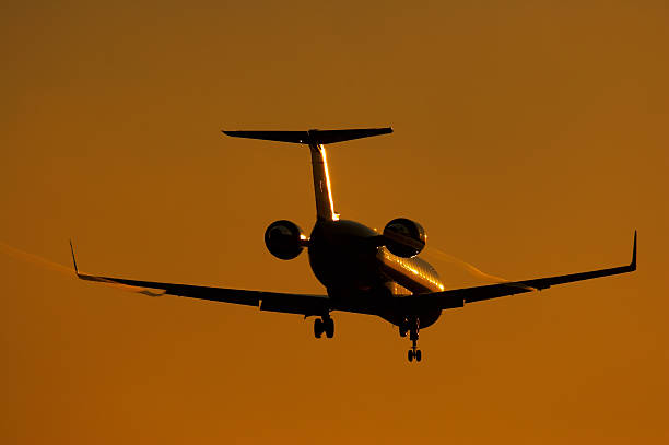 istock Silhouette of regional jet facing sun 137132761