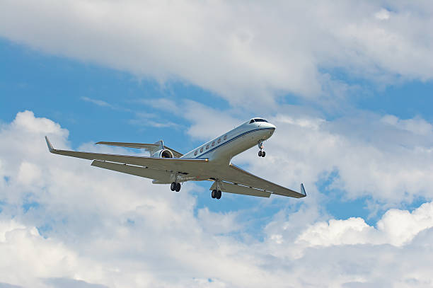 Businessjet on about to land Gulfstream Aerospace G-V businessjet about to touchdown on LAX. turbojet engine photos stock pictures, royalty-free photos & images