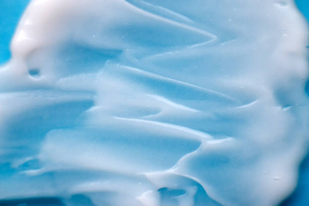 istock texture of white cream on a blue background 1371329269