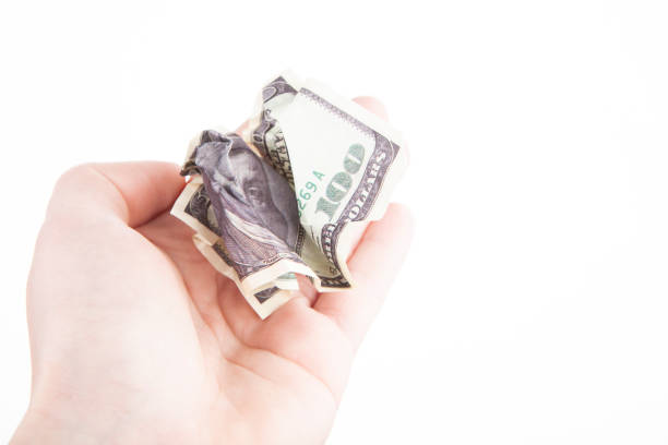 istock image of money hand white background 1371331831