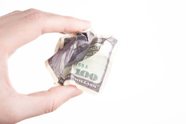 istock image of money hand white background 1371331880