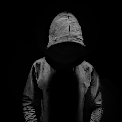 A mysterious man with no face. DARK Hoodie. Unrecognizable silhouette of a man.