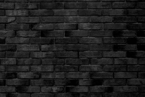 Black brick building wall. Interior of a modern loft.