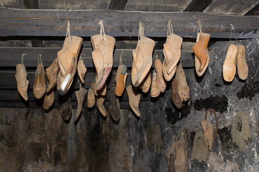evocative image of wooden shoe shapes in a shoemaker's shop
in southern Italy