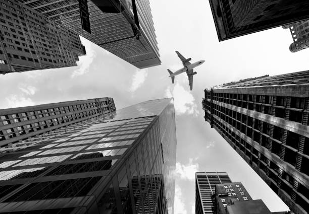 istock Airplane flying over skyscrapers. 1371338899