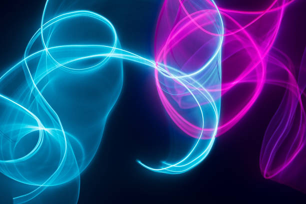 Neon blue and pink led lines on a dark night background. Cyberpunk futuristic backdrop.