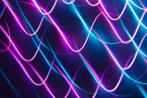 istock Neon blue and pink led lines on a dark night background. 1371339211
