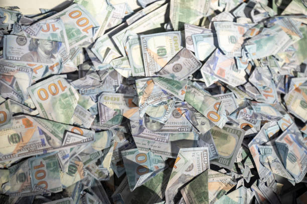 istock Pile with American one hundred dollar bills isolated on white background. 1371339940