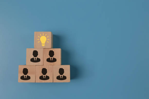 istock Creative idea, teamwork and innovation concept. Wooden cubes with light bulb and office workers icon. 1371340032