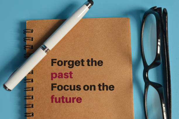 istock Notebook written with FORGET THE PAST and FOCUS ON THE FUTURE 1371340161