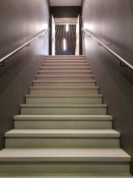 istock Stairs ascending to a door 1371340186