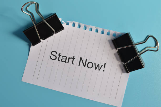 istock Top view of white paper written with START NOW! 1371340283